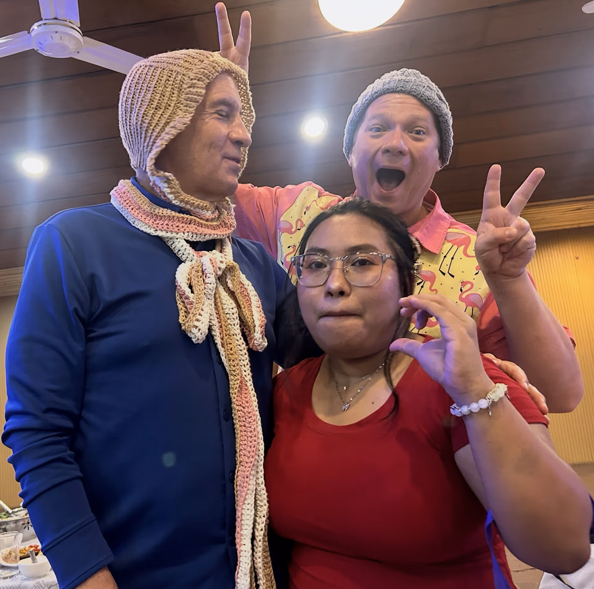 Ajima presents Grandpa Glenn with his knitted hat